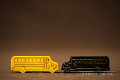 meeple yellow and dark bus with engraver